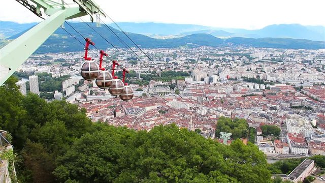 Aerial view of Grenoble, French Alps and cable car from the Bastille hill, France