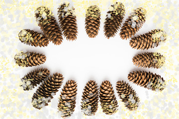 Pine cones in frame with yellow blur
