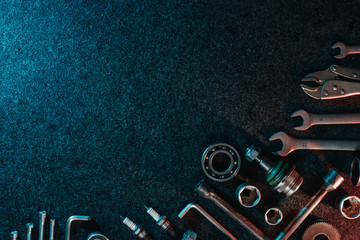 Bearings, wrenches, bolts on a dark background. view from above. Flat design. Automotive subjects....