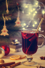Christmas Eve. Hot drink mulled wine, Christmas background. Effect toned image.