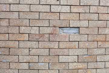 Brick wall with a floating cracked