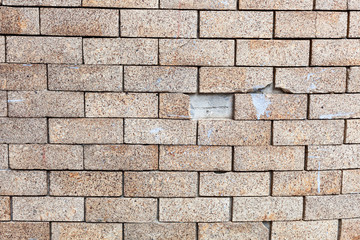 Brick wall with a floating cracked