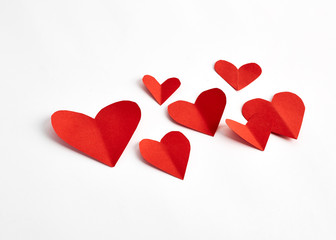 Red paper hearts isolated on white