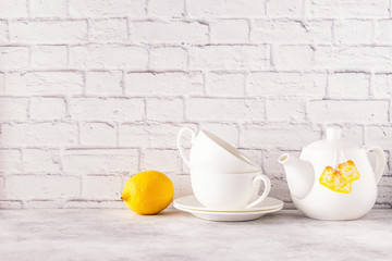 Two cups and teapot for morning tea.