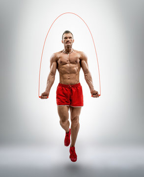 Man Bodybuilder Jumping With Jump Rope