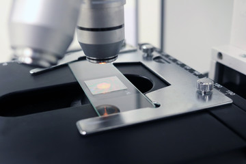 Laboratory Microscope for education and research scientific in classroom.- Selective focus on glass slide.