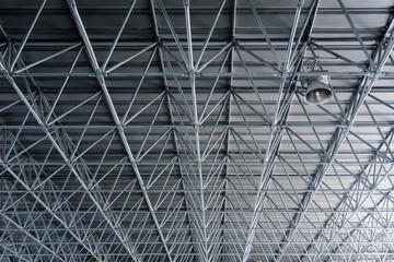 Metal roof structure ceiling in warehouse architecture design concept.