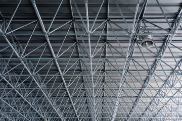 Fototapeta premium Metal roof structure ceiling in warehouse architecture design concept.