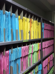 Customer paper data in cabinet shelf of hospital or clinic.