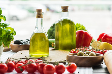 olive oil bottles with vegetables