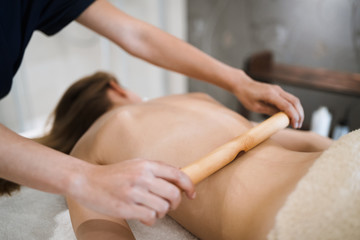 Obraz na płótnie Canvas Masseur massaging masseuse at wellness resort