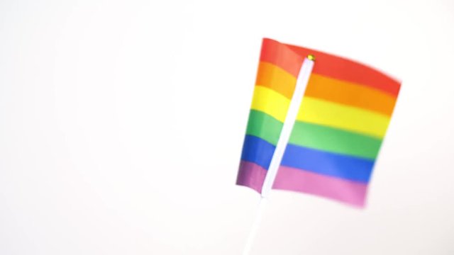 gay or lgbt pride rainbow colored flag waving