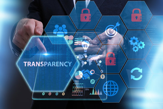 Business, Technology, Internet and network concept. Young businessman working on a virtual screen of the future and sees the inscription: Transparency