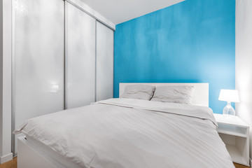 Bedroom with blue wall