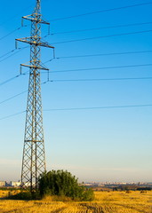 High-voltage power transmission line. Energy pillars. At sunset, dawn. high-tension