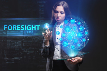 The concept of business, technology, the Internet and the network. A young entrepreneur working on a virtual screen of the future and sees the inscription: Foresight