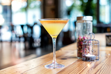 Close-up of a yellow cocktail in a stemmed glass