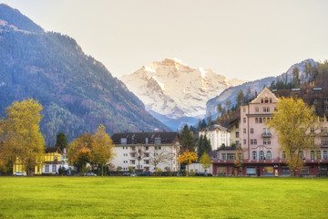 Fototapeta na wymiar Beautiful of Alps mountain and village at Autumn in Interlaken canton, Switzerland
