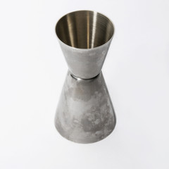 Barmen measuring pile (jigger), isolated, against background.