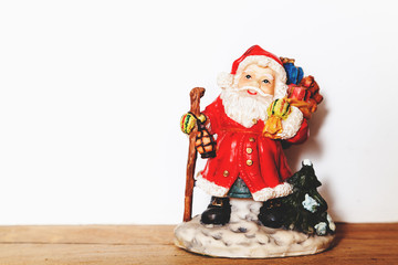 Figurine of Santa Claus on a white background closeup