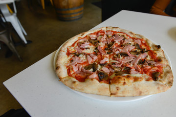 Ham pizza on the table