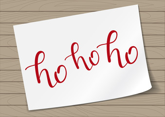 Ho-ho-ho Hand Drawn Lettering on A4 Paper Sheet Background. Vector Illustration Quote. Handwritten Inscription Phrase for New Year Holiday Design, Poster, Sale, Banner, Invitation.