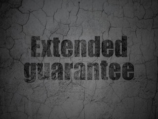 Insurance concept: Black Extended Guarantee on grunge textured concrete wall background