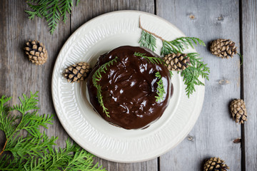 Creamy cake with chocolate glaze on the rustic background. Selective focus. Shallow depth of field.