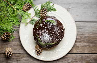 Creamy cake with chocolate glaze on the rustic background. Selective focus. Shallow depth of field.
