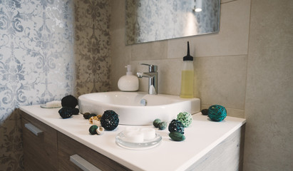 Sink and tap with soap and decoration