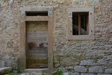 Fototapeta na wymiar A disused building in hill village of Erto in Friuli Venezia Giulia, north east Italy. 