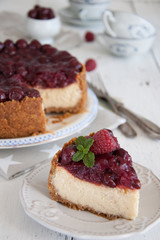 Homemade cheesecake with cherries on a plate