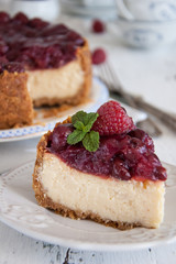 Homemade cheesecake with cherries on a plate