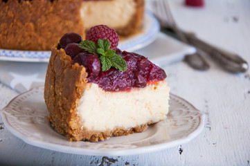 Homemade cheesecake with cherries on a plate