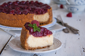 Homemade cheesecake with cherries on a plate