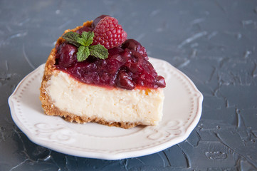 Нomemade cheesecake with cherries on a plate