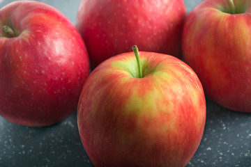 Fototapeta na wymiar Set of fresh red apples on black background with copy space 