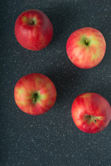 Set of fresh red apples on black background with copy space 