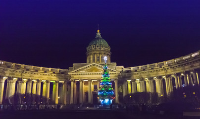 Night view of the New Year fir tree in garlands on the square in front of Kazan Cathedral in Saint Petersburg in the winter New Year. Russia