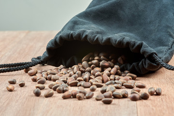 Pine nuts, pouring out of the bag.