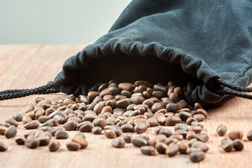 Pine nuts, pouring out of the bag.