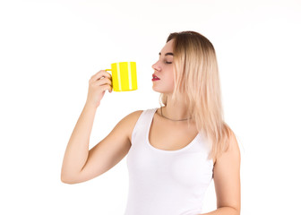 Young cute woman drinks coffee or tea, isolated  