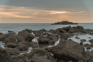 Fototapeta na wymiar sunrise scenic with stone in foreground