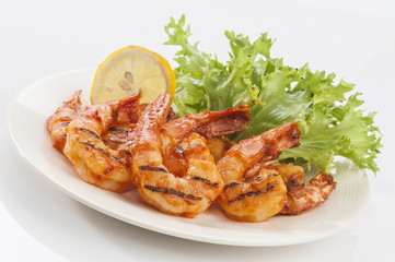 Grilled Jumbo headless shrimp with tikka marinade with lemon tomato and lettuce  