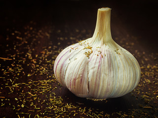 Garlic on the wooden brown cooking table