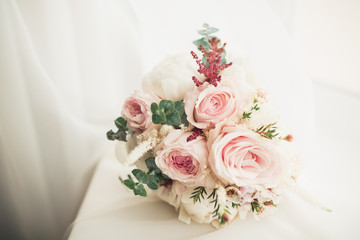 Beautiful wedding bouquet with different flowers, roses