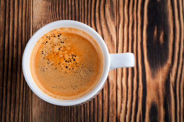 Coffee cup on wood