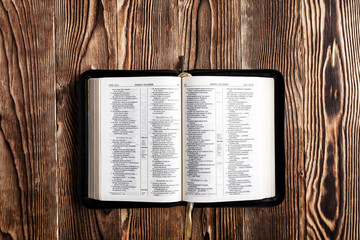 Open bible Book on wood background
