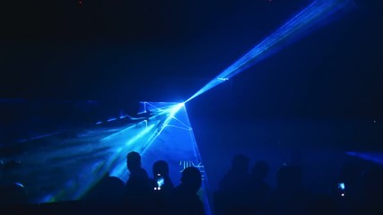 Colored laser light show in a club