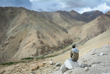 Asian traveler enjoying mountain view